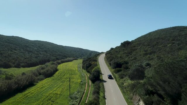 Car driving on a countryside road landscape in Portugal