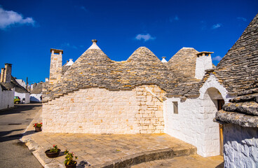 Historic Trulli houses in the city of Alberobello in Italy - a tourist attraction - travel...
