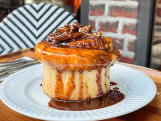 Fresh sweet homemade Brioche bread topped with pecan nut and caramel