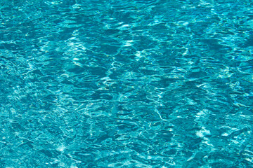 Water in swimming pool, background with high resolution. Wave abstract or rippled water texture.