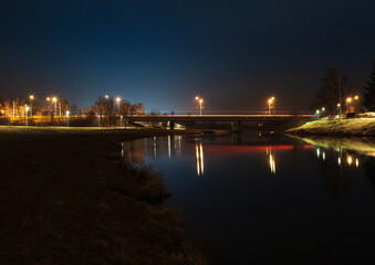 Large traffic bridge above river Vltava in city Ceske Budejovice at night. Long exposure, Czech republic