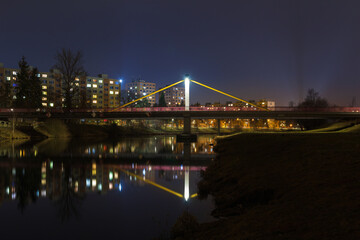 Pedestrain bridge above river Vltava in city Ceske Budejovice at night. Long exposure, Czech republic