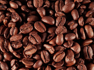 Coffee beans. On a black background. Top view. Space for copying.