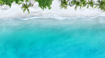 Top view of beautiful tropical beach which summer  Amazing Sandy coastline and white turquiose sea waves. As Aerial view of white sand beach and water surface texture, foamy waves