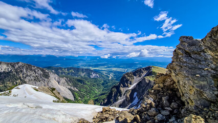 Rock formations with scenic view in spring near Frauenkogel on Rosental in the Karawanks, Carinthia, Austria. Borders Austria, Slovenia, Italy. Triglav National Park. Alpine meadows. Alm. Snow melting