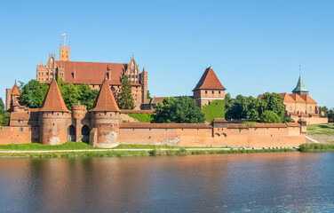 Naklejka premium Malbork, Poland - largest castle in the world by land area, and a Unesco World Heritage Site, the Malbork Castle is a wonderful exemple of Teutonic fortress