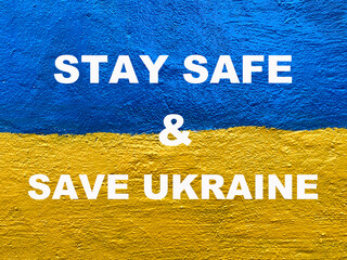 Stay Safe and Save Ukraine message on Ukrainian flag
