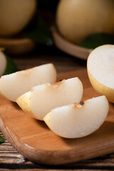 Clipping path of Chinese pear  on wooden table.