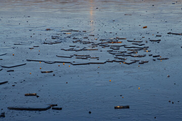 Ice floe lying on a frozen lake for winter background