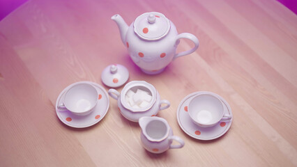 Top down view of retro tea cups and teapot traditional accessories set
