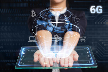 Business, Technology, Internet and network concept. Young businessman working on a virtual screen of the future and sees the inscription: 6G