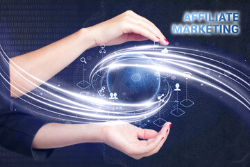 Business, Technology, Internet and network concept. Young businessman working on a virtual screen of the future and sees the inscription: Affiliate marketing