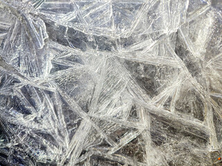 Beautiful ice needle's texture on the surface of a frozen lake.