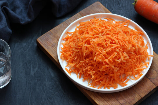 Grated Raw Carrots On A White Plate