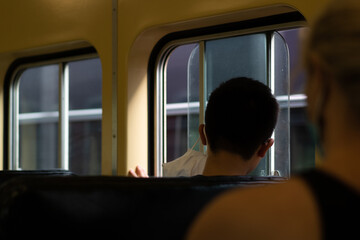view of people from behind on public transport