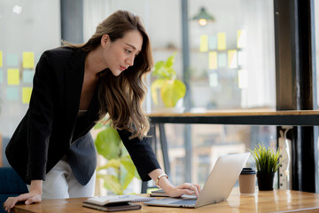 Beautiful Asian woman is a businesswoman who leads a new generation of startups, a woman who runs...