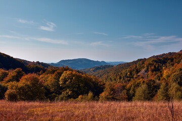 Fototapeta na wymiar View of countryside hilly landscape in autumn colors.