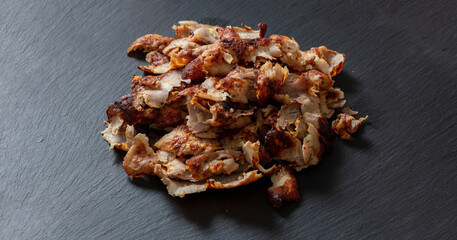 Shawarma gyro, Greek, Turkish, traditional meat food on black color background, overhead