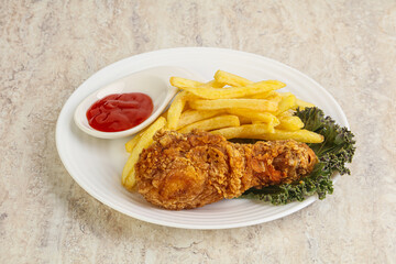 Crispy chicken leg with fry potato