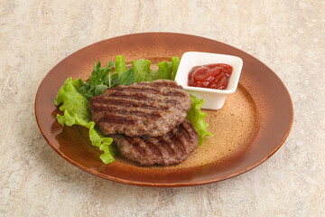 Grilled beef burger cutlet with sauce