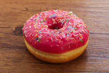 Sweet glazed struwberry donut with icing