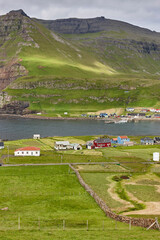 Obraz premium Picturesque Faroe islands landscape and coastline village, Famjin. Suduroy