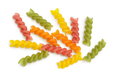 raw Fusilli colored pasta, isolated on white background with clipping path and full depth of field. Top view. Flat lay