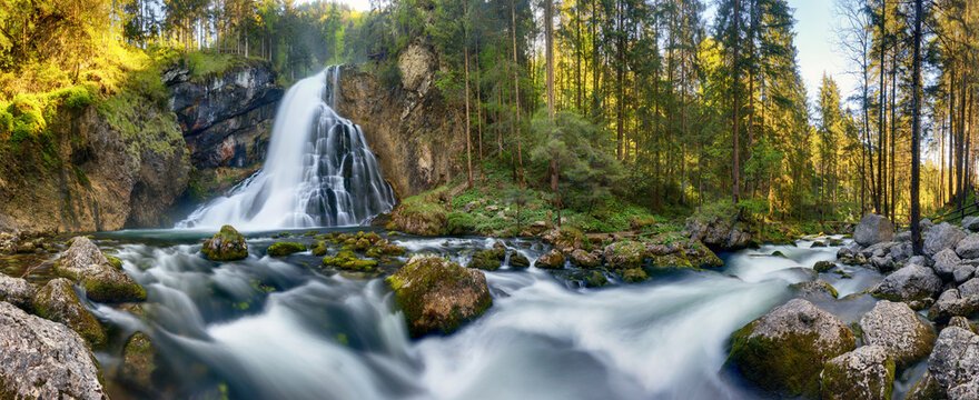 Waterfall in the forest, Austria landscape panorama