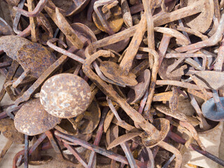 abundant rusty old round nails with signs of use