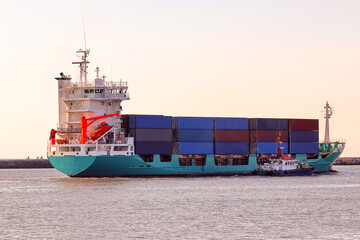 Container ship in sunset in the sea
