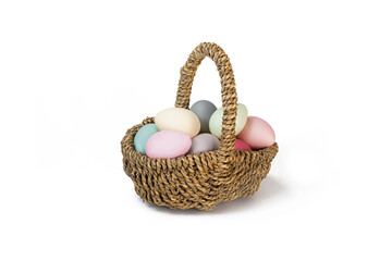 Easter Egg Basket with multicolored Eggs isolated on a white background. Easter eggs pastel colours.