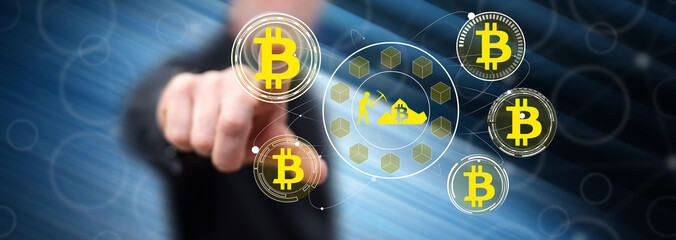 Man touching a bitcoin mining concept
