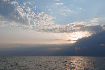 Obraz na płótnie Canvas Seascape of sunset among the open sea