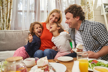 Portrait of happy parents and children having fun