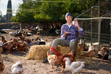 male worker in ecological chicken farm