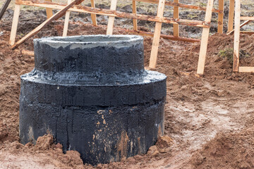 Installation of a reinforced concrete well for water supply and sewerage at the construction site....