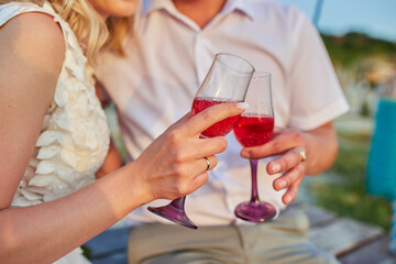 Just married couple with glasses of champagne. Close-up. Wedding concept