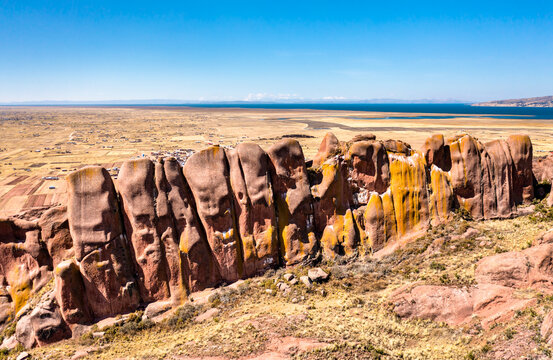 Reddish rock formations in Aramu Muru near Puno in Peru