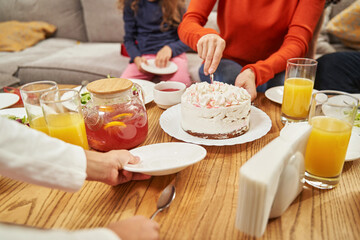 Happy children and parents eating at home