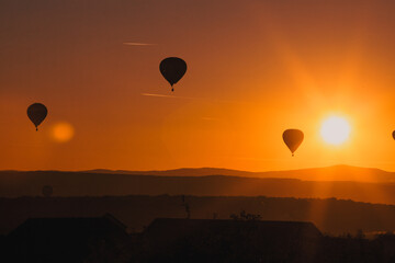 hot air balloons at sunset - freedom and adventure concept