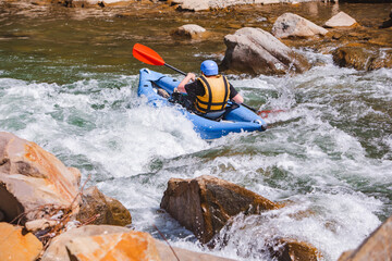 inflatable raft extreme sport at mountain river