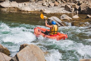 inflatable raft extreme sport at mountain river