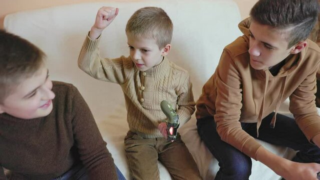 children playing on the console with joysticks in ruhs close-up