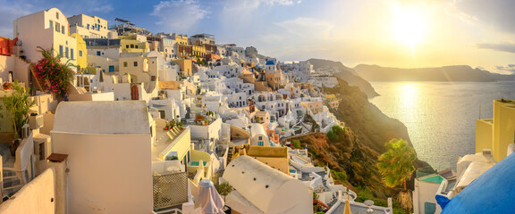 Picturesque sunrise on famous view resort over Oia town on Santorini island, Greece, Europe. famous...