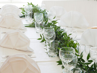 Wedding table decoration with a garland
