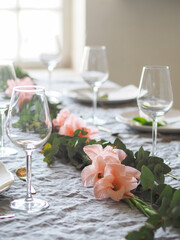 Wedding table setting with flower garland
