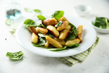Potato dumplings with fresh spinach