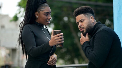 Girl sharing cellphone screen content online on phone two people sharing content