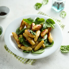 Potato dumplings with fresh spinach