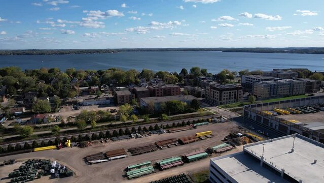 Aerial View of Industrial Railway and Neighborhood of Madison, Wisconsin USA With Lake Monona in Background - Drone Shot